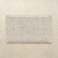 Decorative mat with floral pattern on a beige background