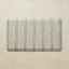 Textured rectangular mat on a beige background
