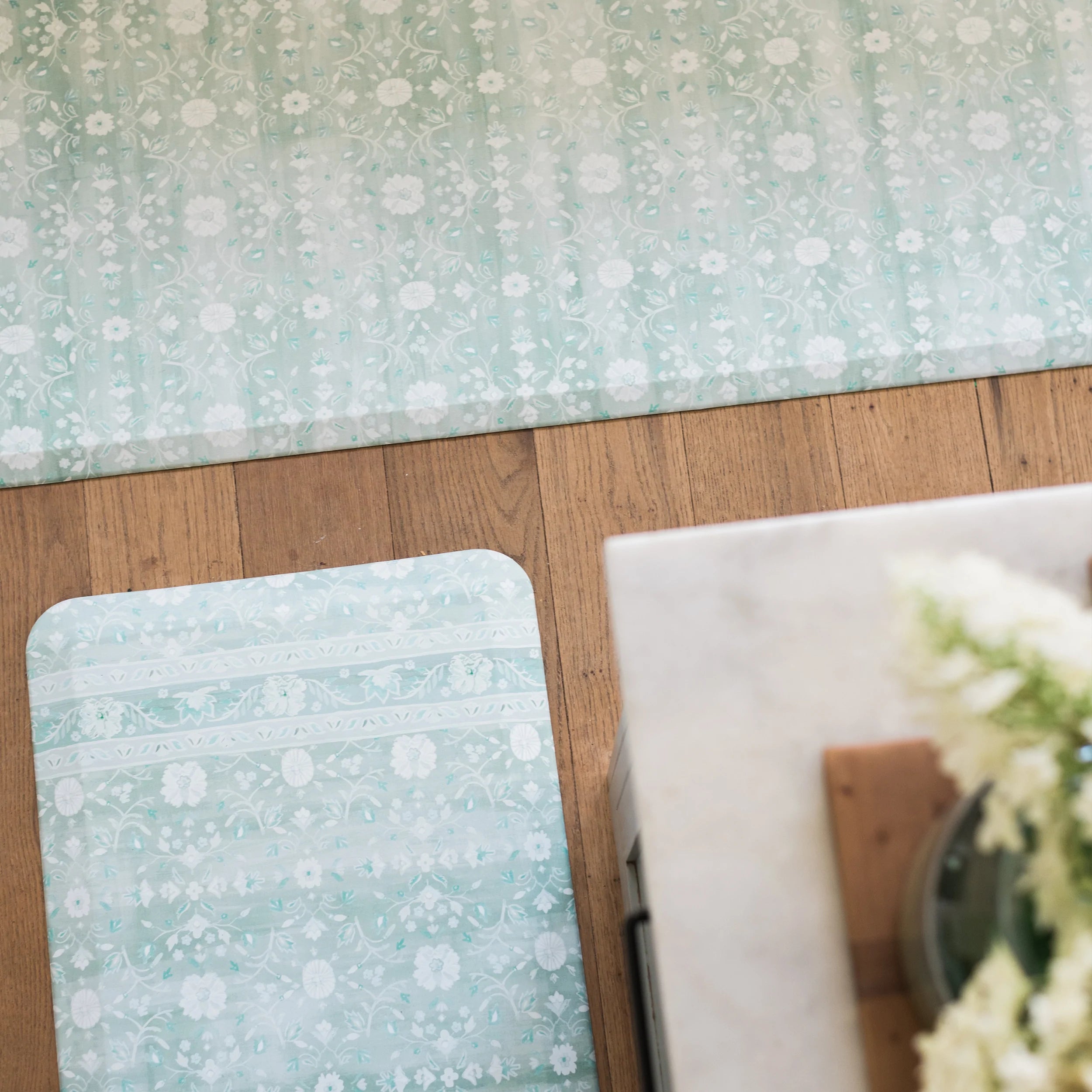Nama standing mat Gemma white sage green in sizes 20x32 and 30x108 shown from above in kitchen