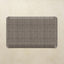 Rectangular mat with a grid pattern on a beige background