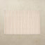 Rectangular tumbling mat with vertical striped pattern on a beige background