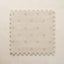 Beige interlocking foam play mat on a beige background