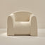 white textured armchair on a neutral background