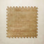 A square interlocking foam play mat tile in warm mustard with a scattered cream diamond dot motif, shown from above on a light beige background.