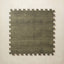 A square interlocking foam play mat tile in mossy olive green with a tonal diamond dot motif, shown from above on a light beige background.