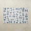 Selene Riviera 4x6 tumbling mat with watercolor dusty blue half-circles on a white base