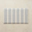 Rectangular kitchen mat with blue stripes on a beige background