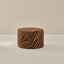 Small round foam ottoman in amber and sable zebra pattern from House of Noa