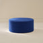 Blue ottoman on a beige background