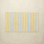 Beige bath mat with blue stripes on a beige background