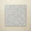 Floral patterned foam puzzle mat on a beige background