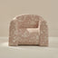 Floral-patterned armchair on a neutral background