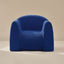 Blue textured armchair on a beige background