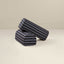 Striped blue armrests on a beige background
