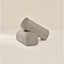Two cylindrical armrests with a striped pattern on a beige background