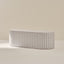 Striped coffee table on a neutral background