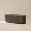 A striped taupe and sable brown fabric-covered coffee table with a soft foam construction.