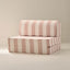 A foldable children's chair with a striped pattern in pink and white, made with soft fabric.