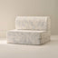 Floral-patterned play couch seat on a beige background