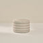 Striped cylindrical container on a plain background