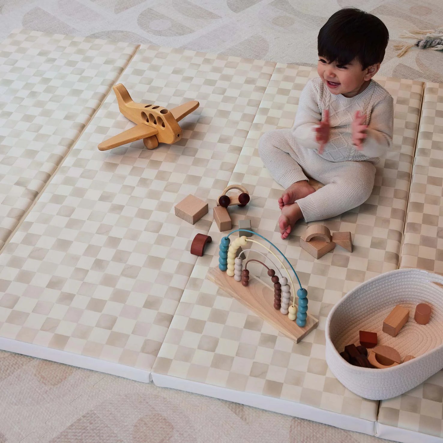 baby playing on tumbling mat