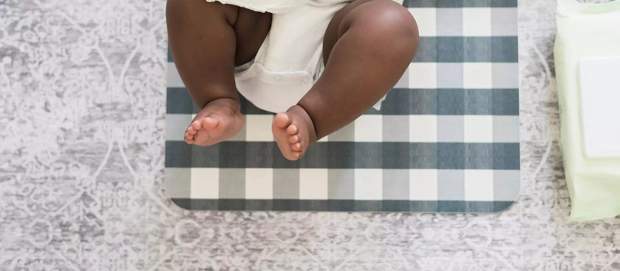 Newport check navy and white checkered changing mat with baby feet