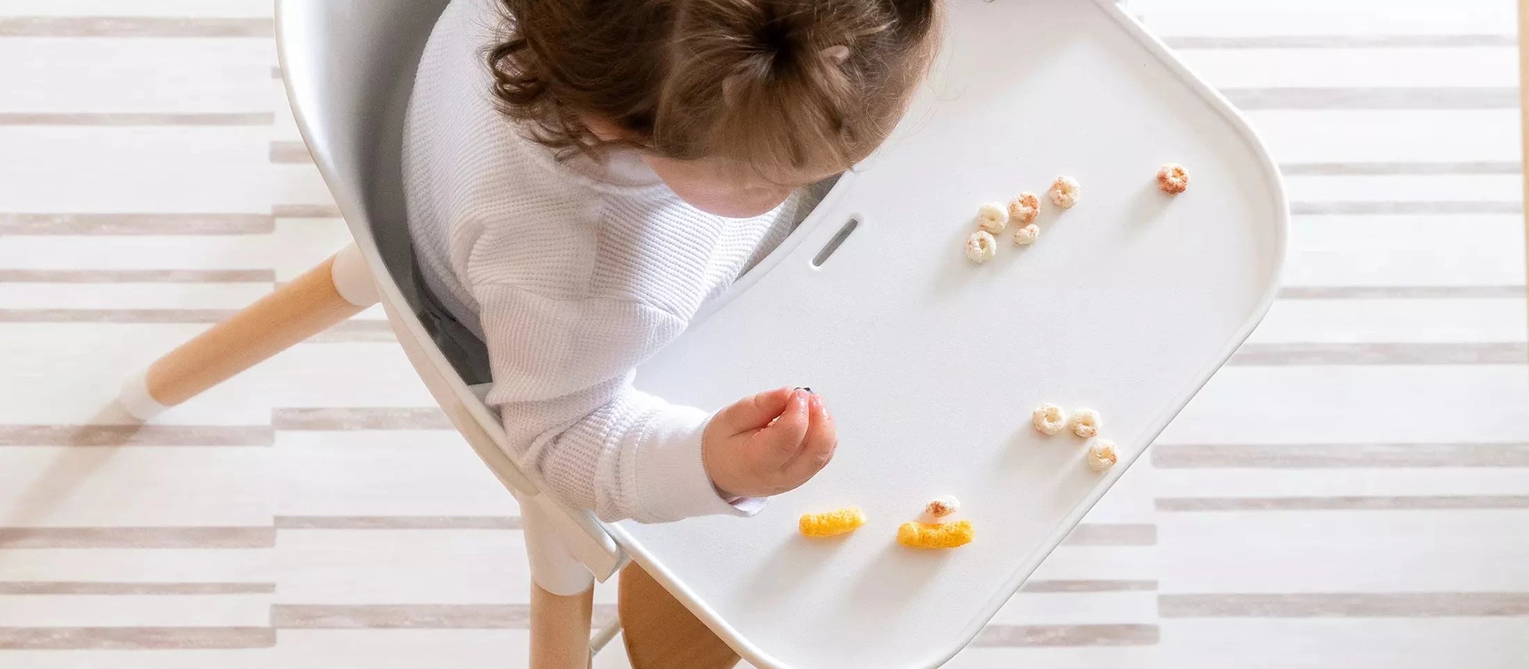 Nara Stripe Natural Minimal Baby Splat Mat with Baby eating in high chair