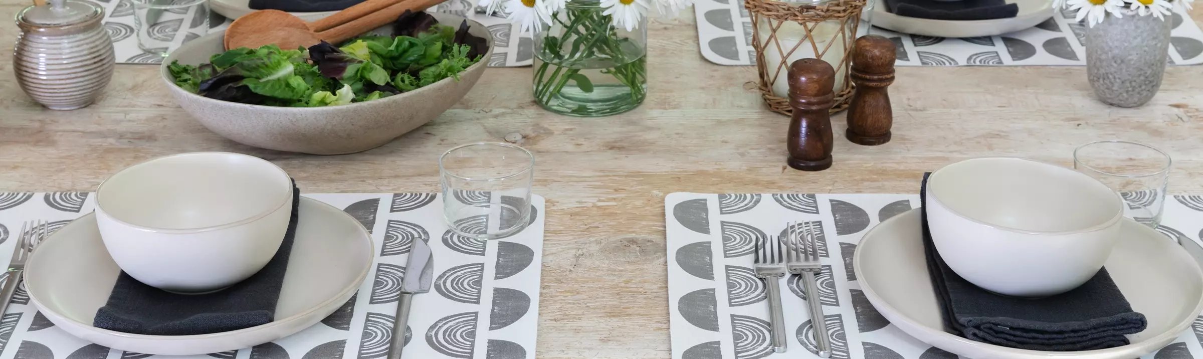 Ada Char black and white place mat shown on a table with place setting