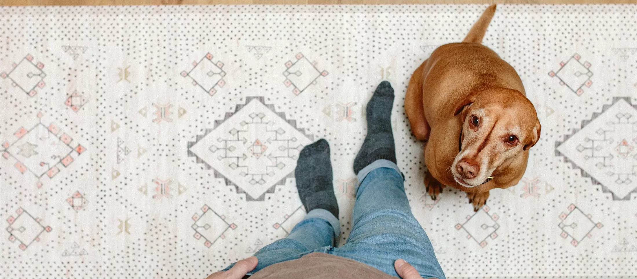 Ula Oat Neutral boho kitchen mat with man and dog