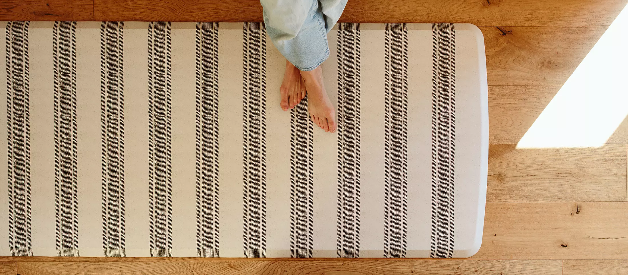Cabin stripe gray and cream striped standing mat with feet