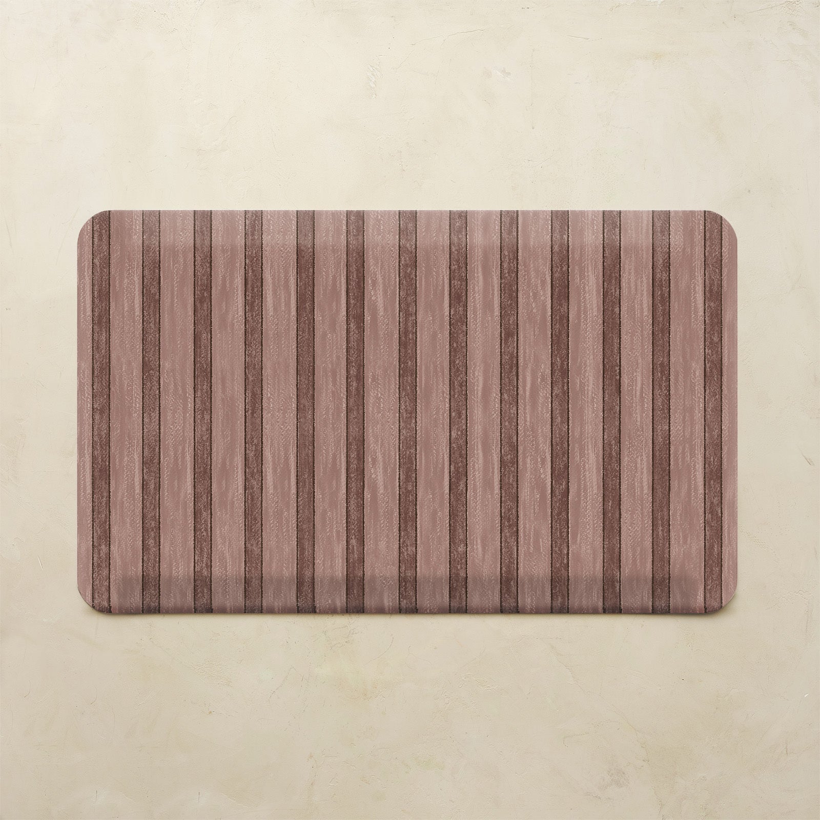 Maroon kitchen mat with striped pattern on a beige background