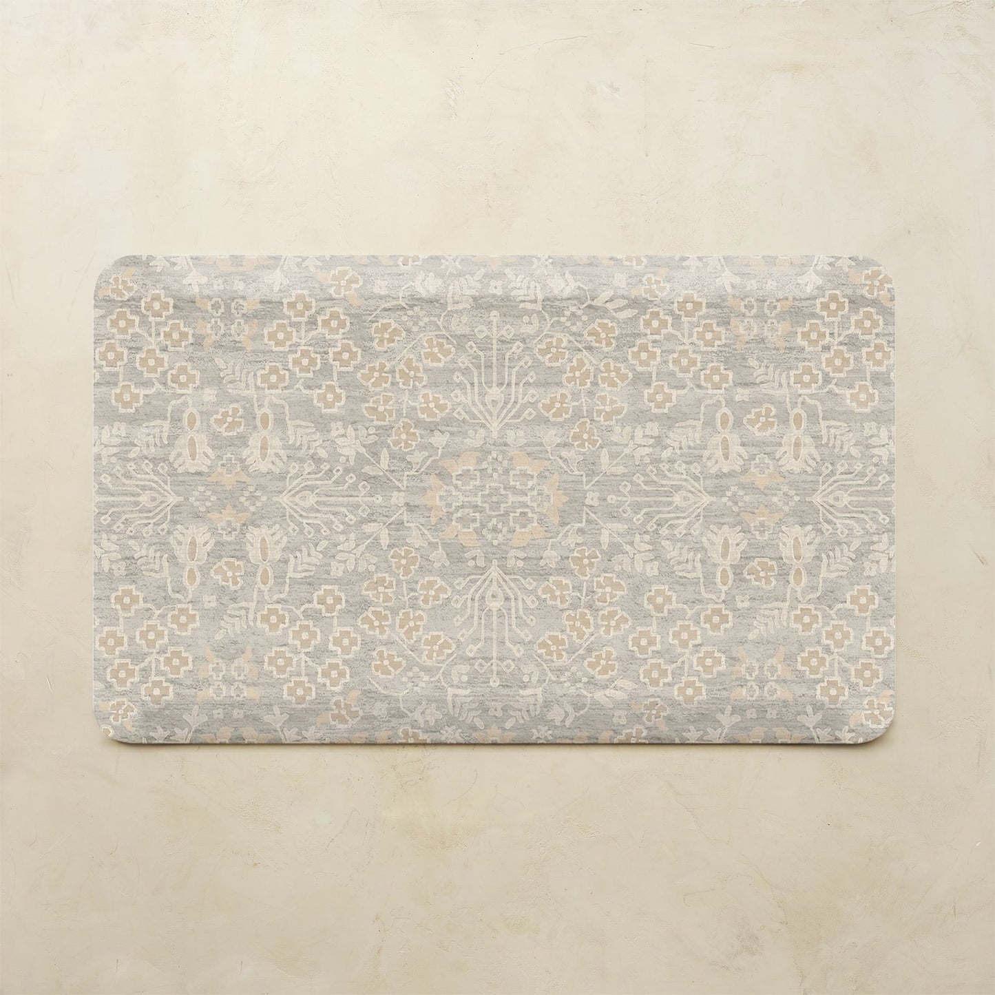 Decorative mat with floral pattern on a beige background