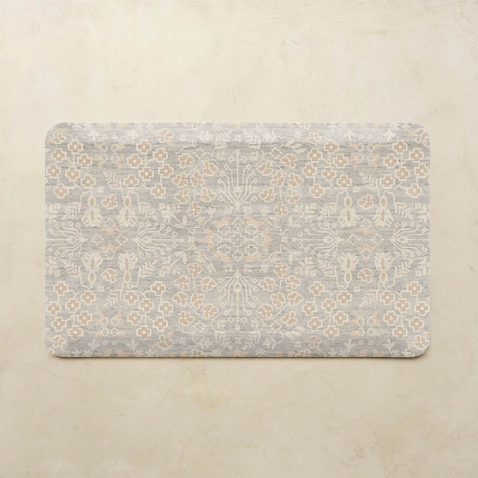 Decorative mat with floral pattern on a beige background