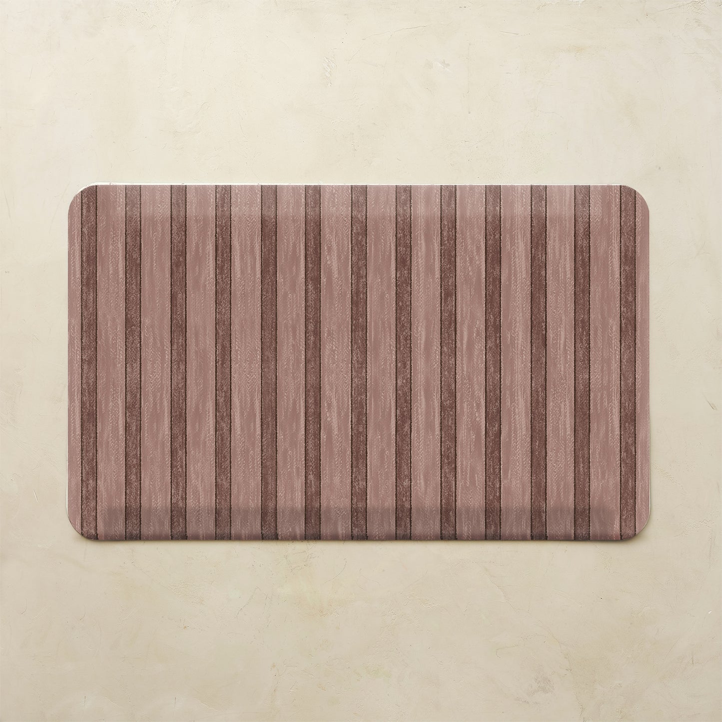 Maroon kitchen mat with striped pattern on a beige background