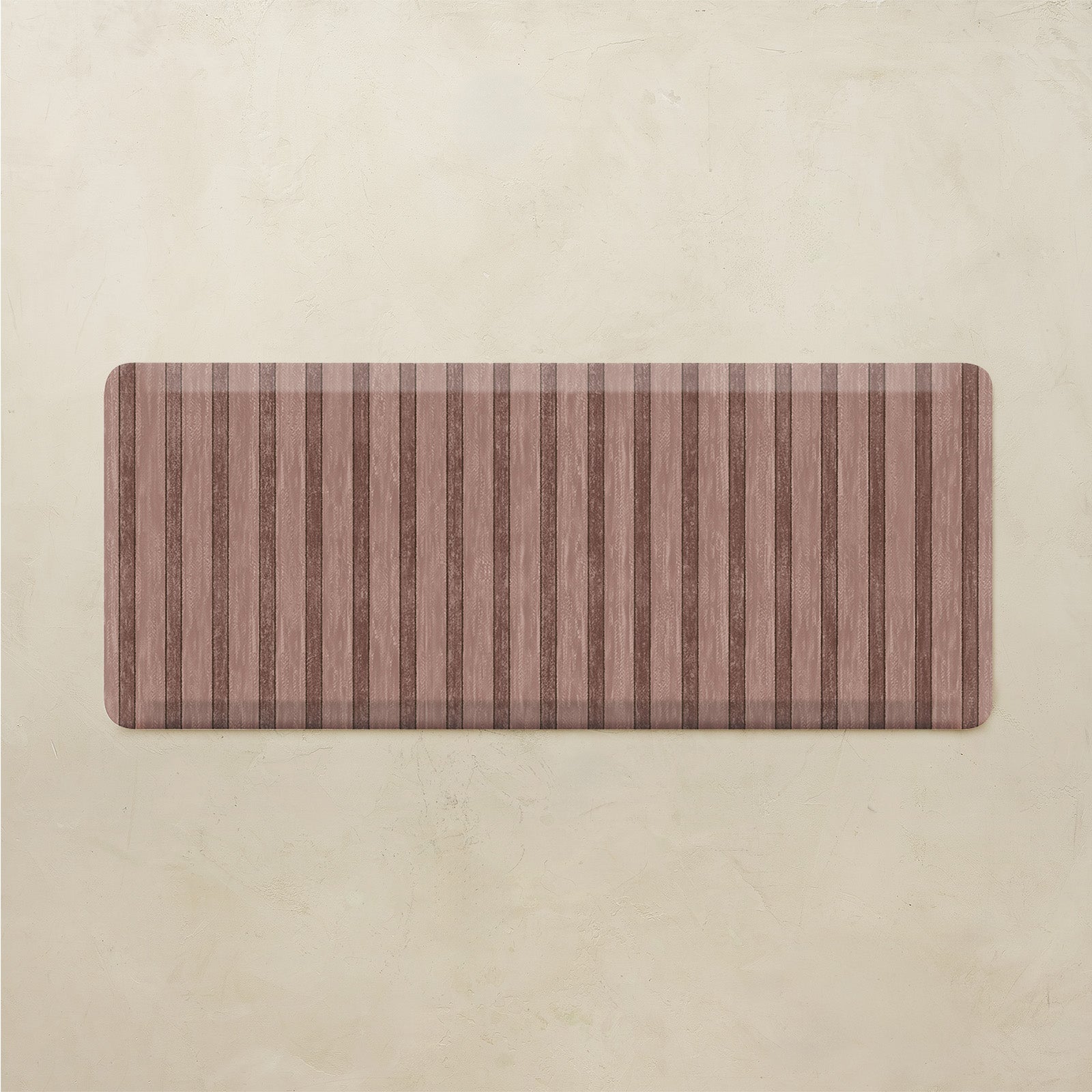 Maroon kitchen mat with striped pattern on a beige background