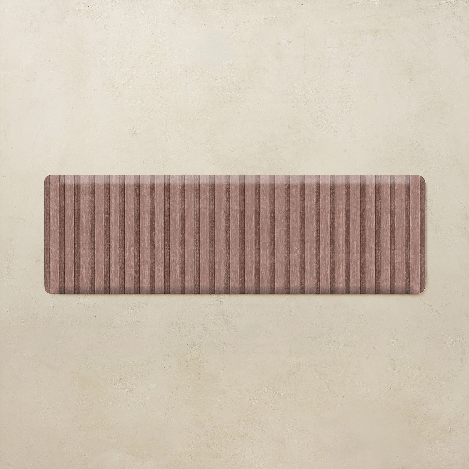 Maroon kitchen mat with striped pattern on a beige background