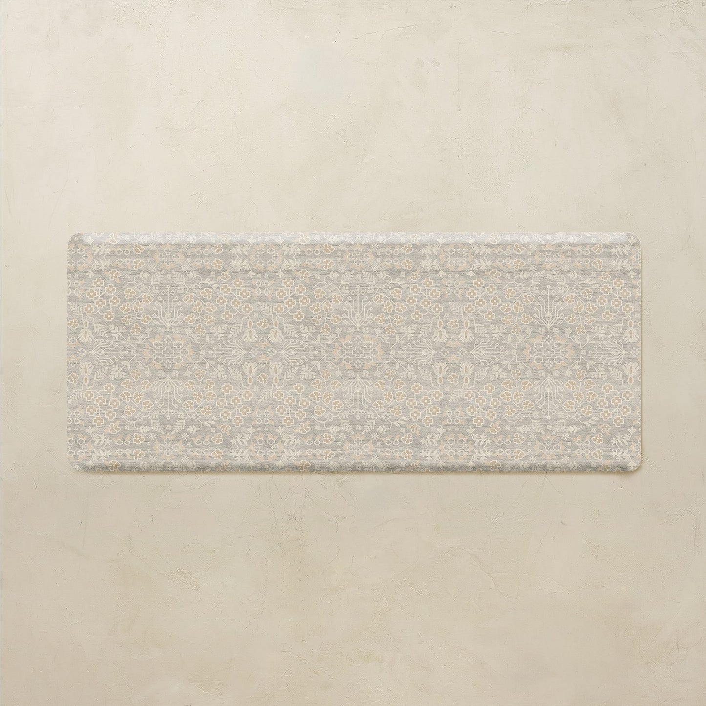 Rectangular floral mat on a beige background