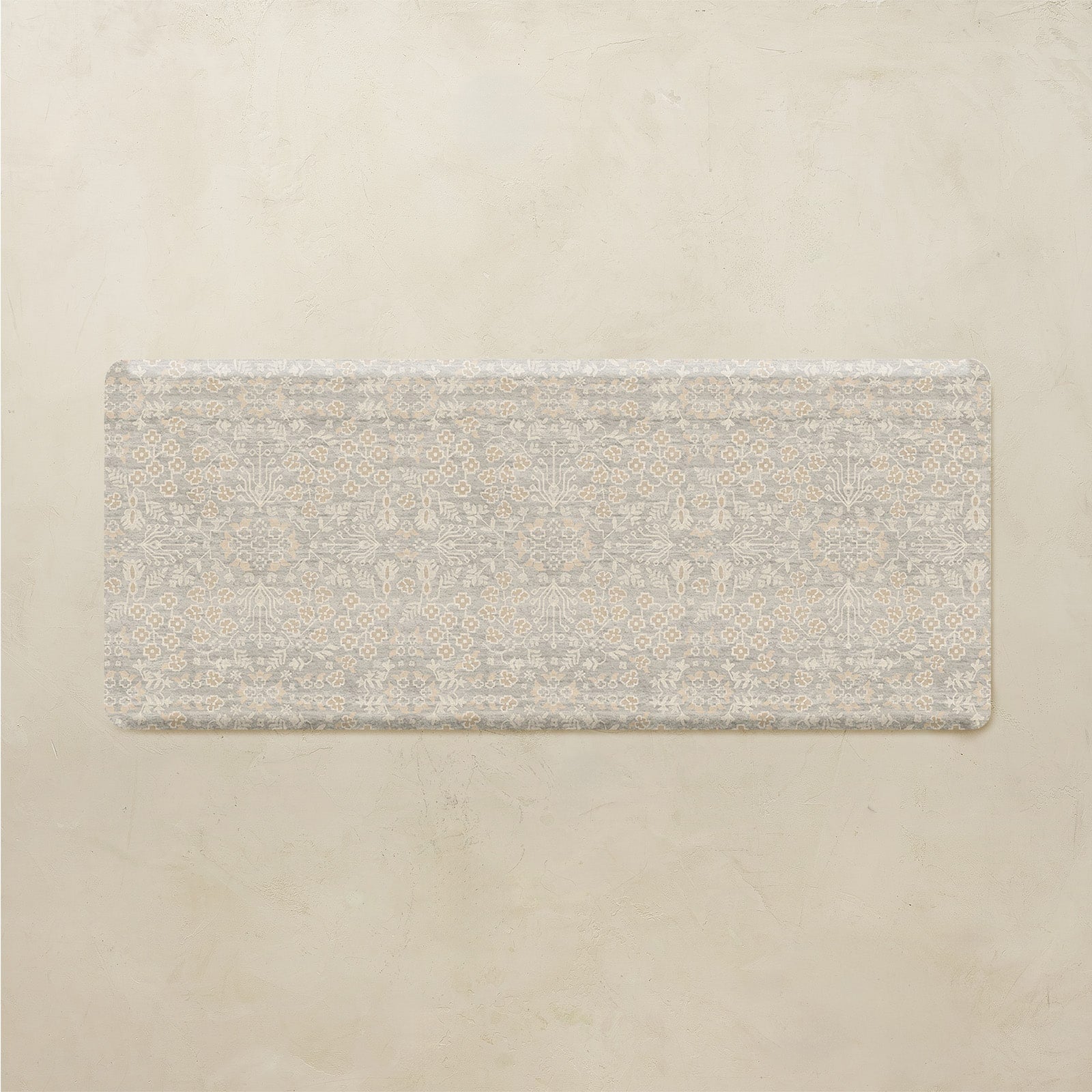 Rectangular floral mat on a beige background