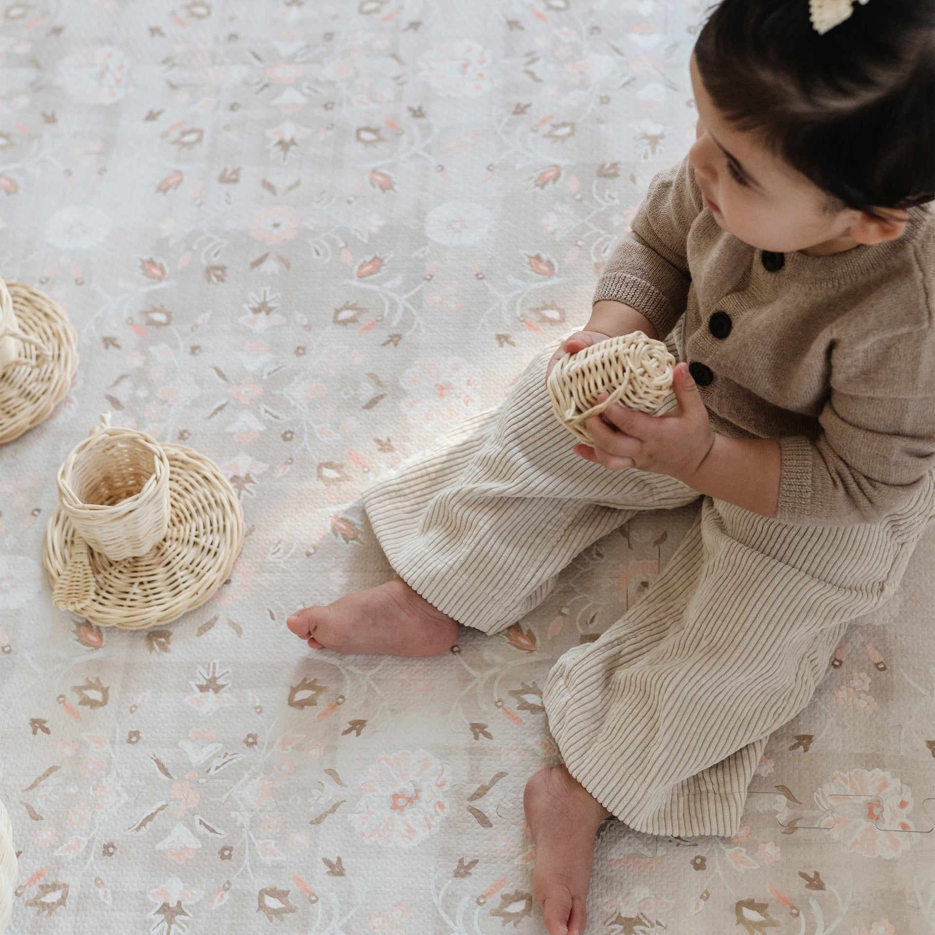 Linen beige and light pink floral baby play mat with baby girl play with tea set