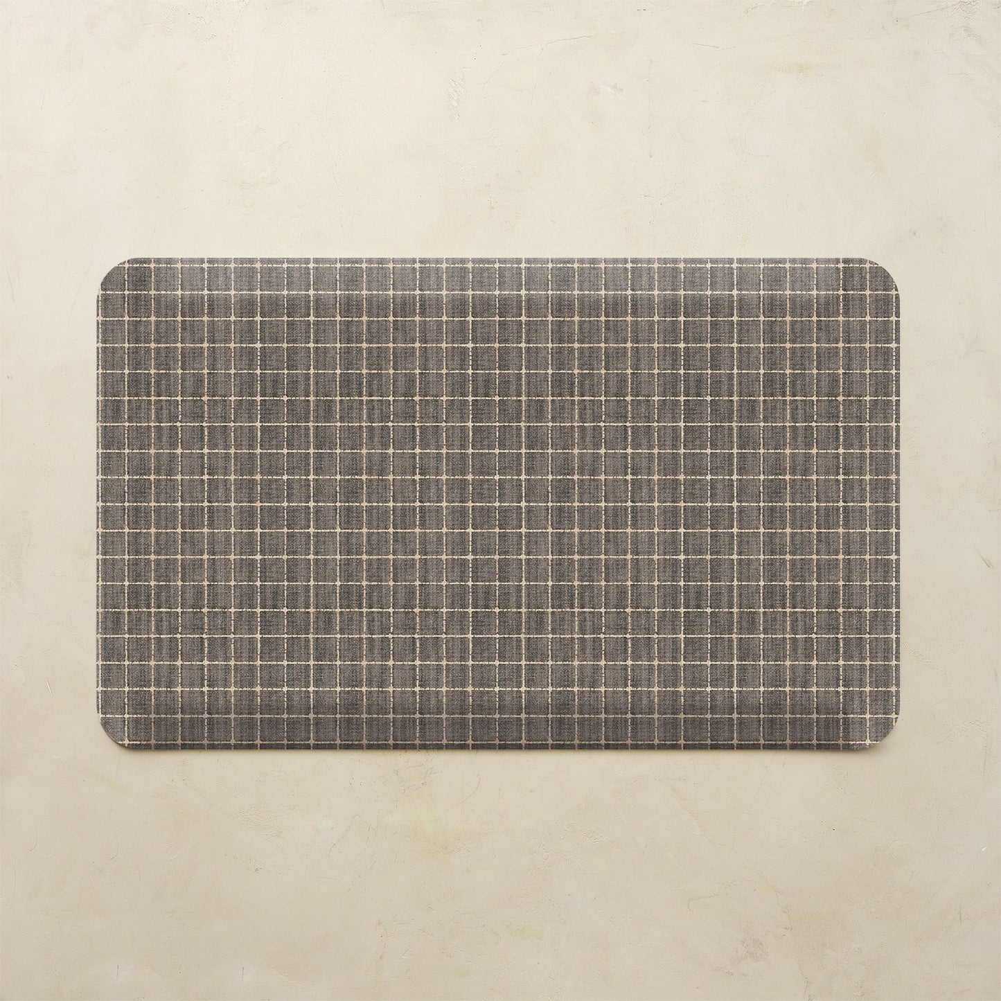 Rectangular mat with a grid pattern on a beige background
