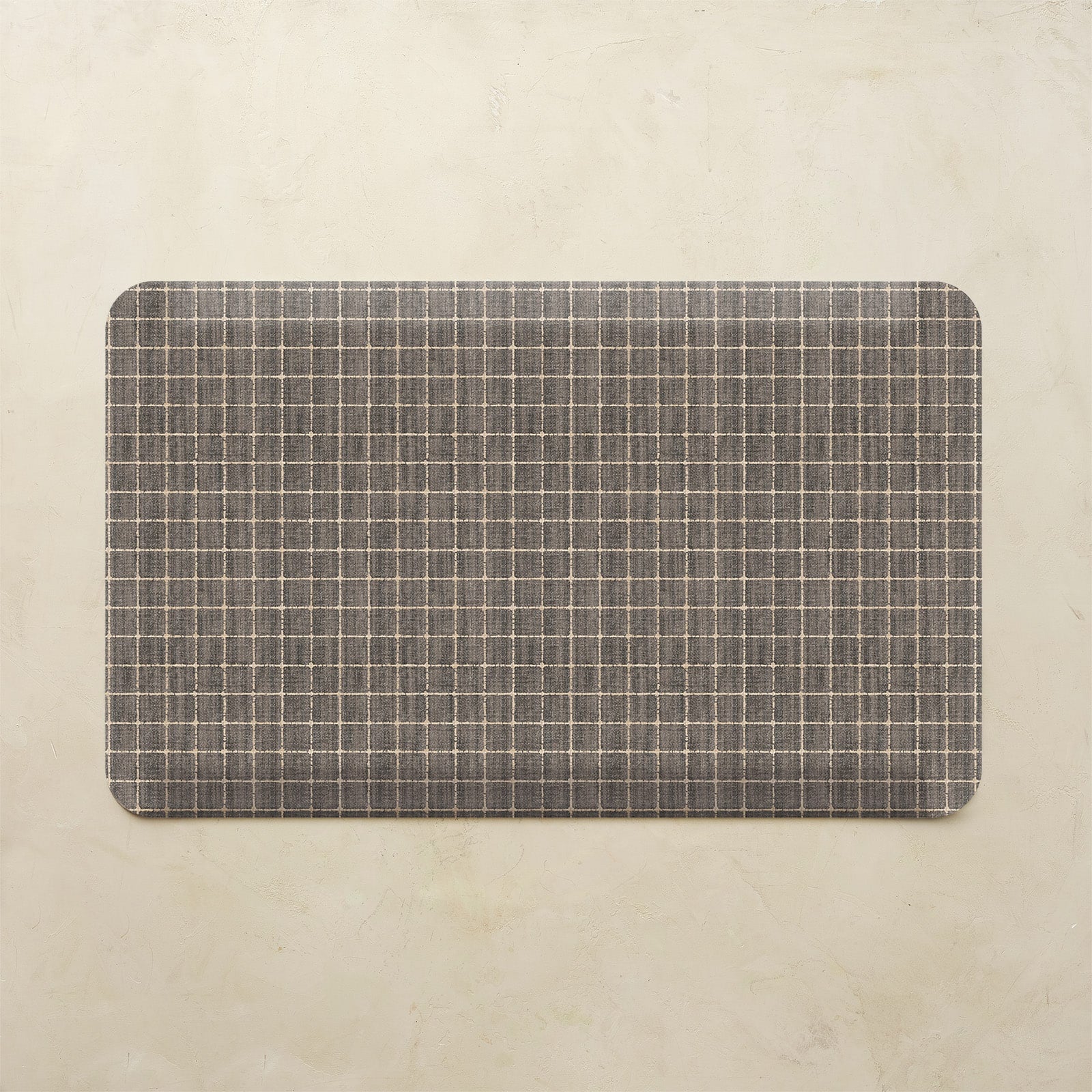 Rectangular mat with a grid pattern on a beige background