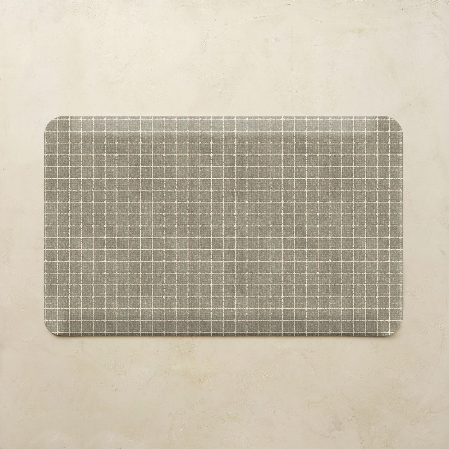 Rectangular mat with a grid pattern on a beige background