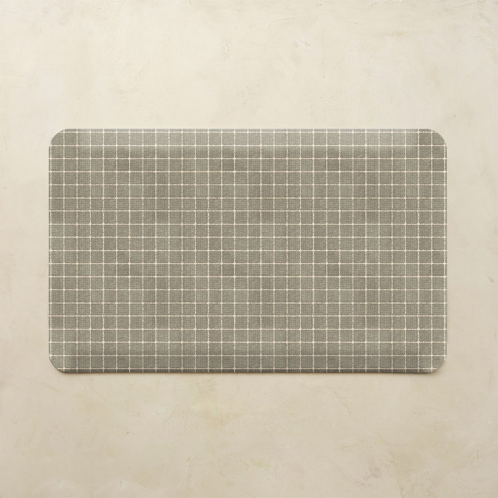 Rectangular mat with a grid pattern on a beige background