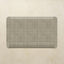 Rectangular mat with a grid pattern on a beige background
