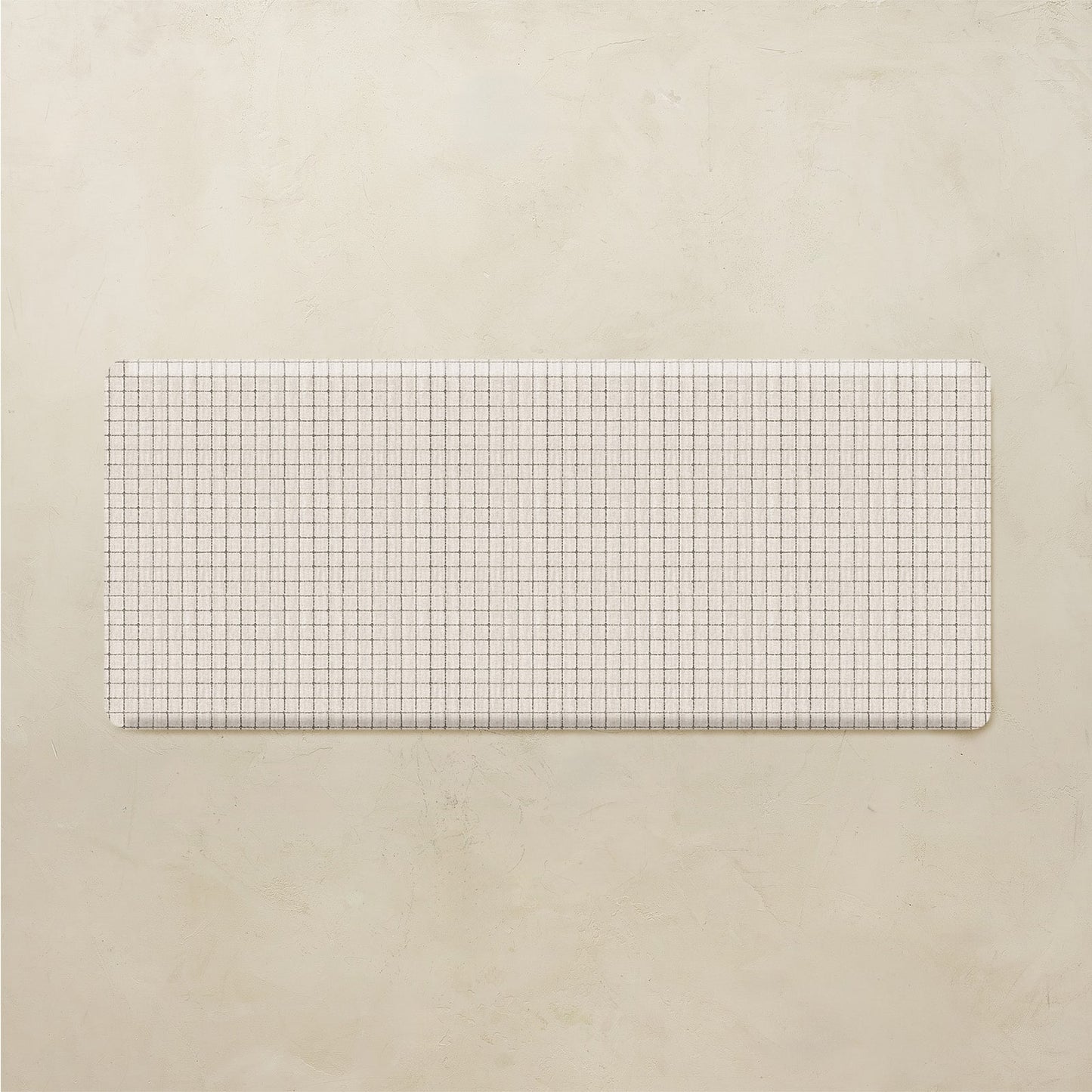 Rectangular grid patterned mat on a beige background