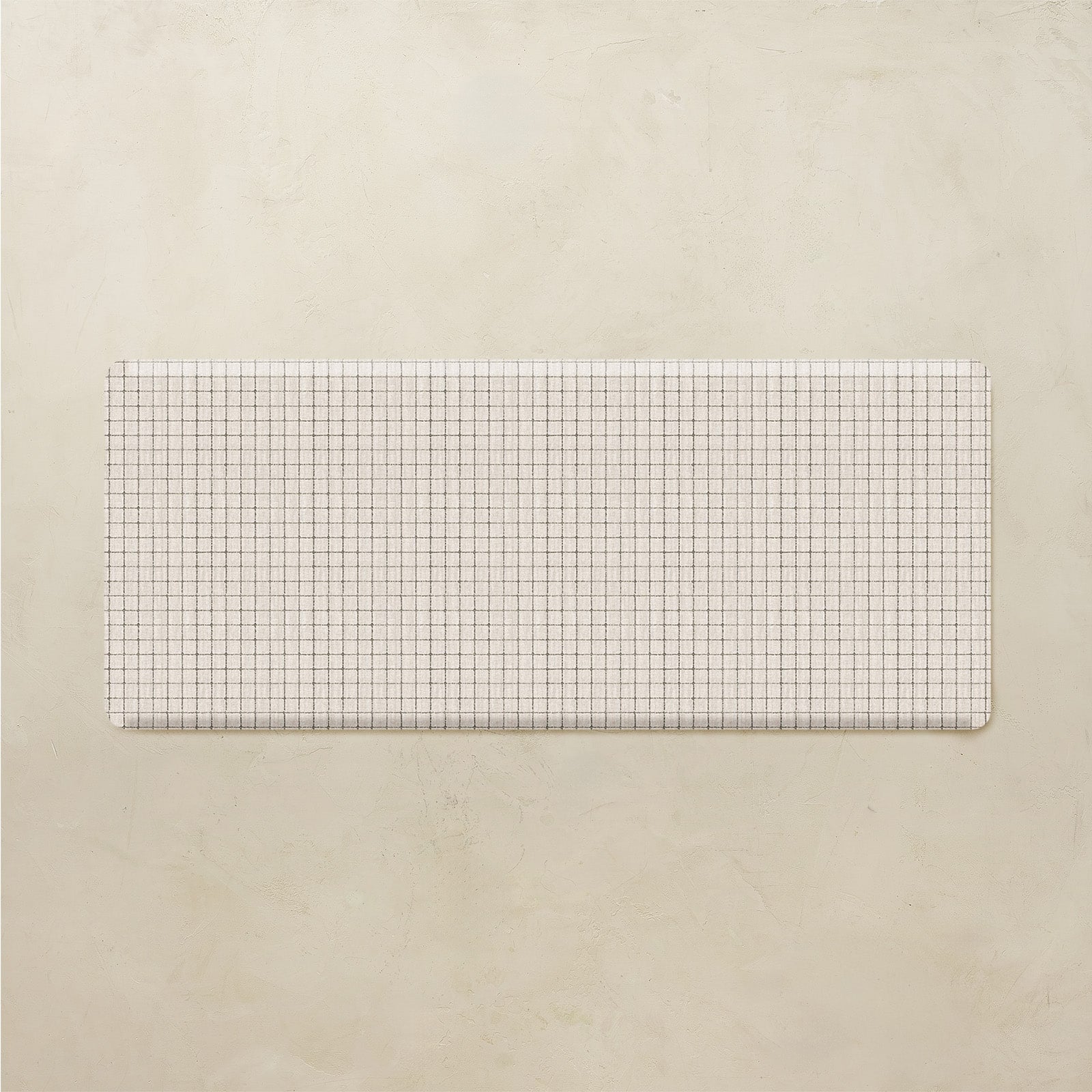 Rectangular grid patterned mat on a beige background
