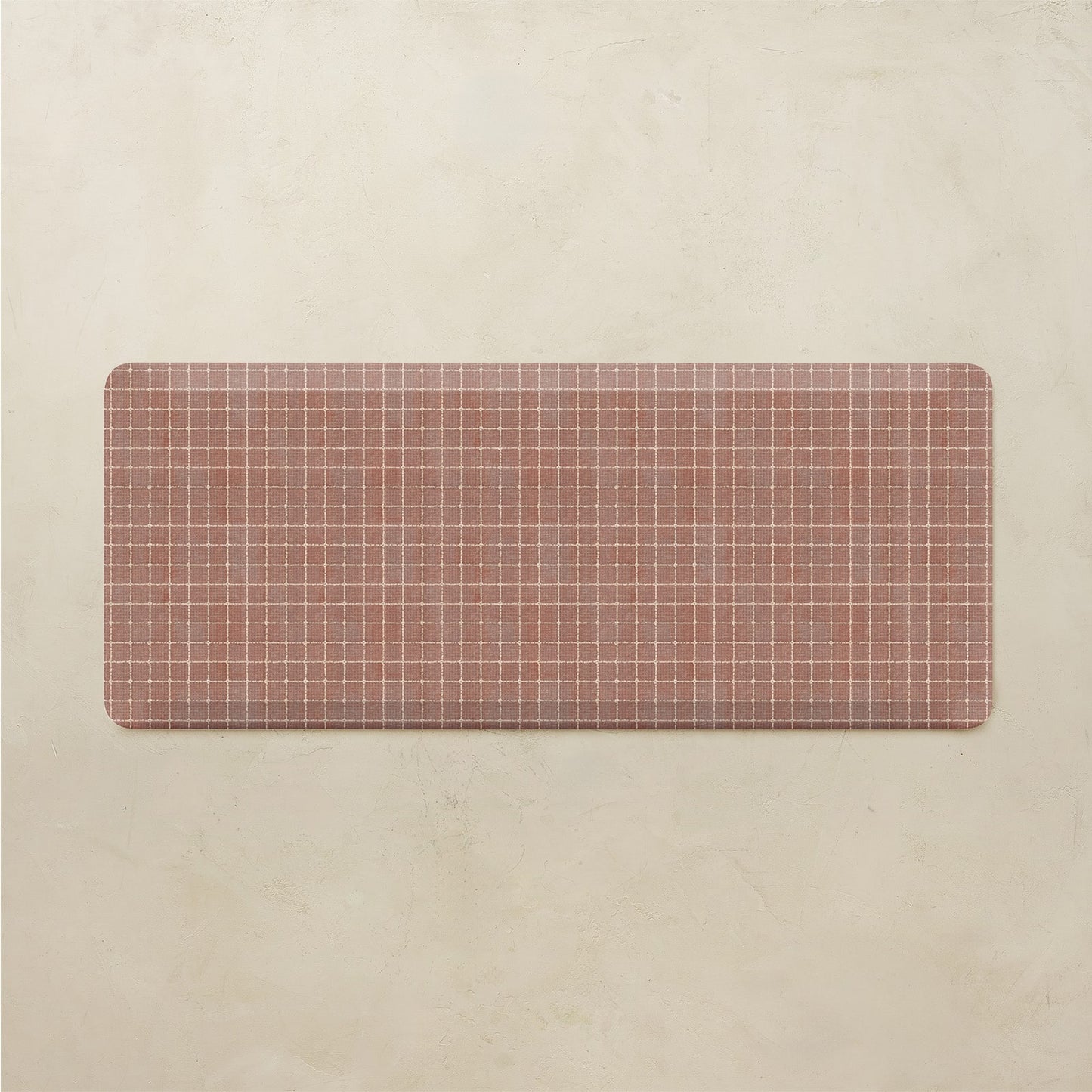 Rectangular grid-patterned mat on a beige background