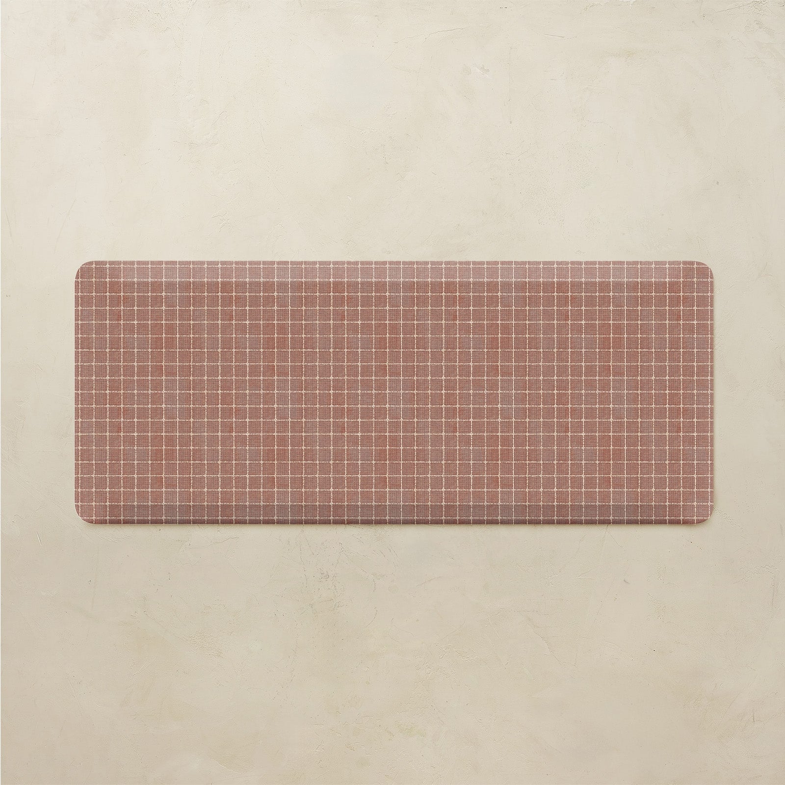 Rectangular grid-patterned mat on a beige background