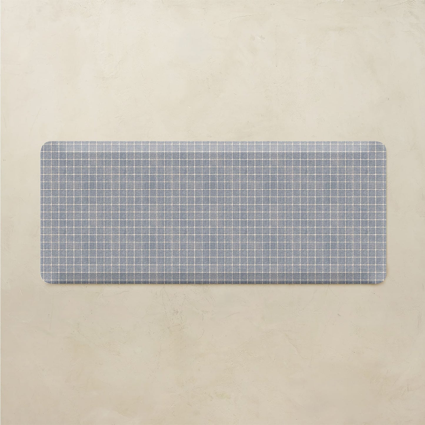 Rectangular mat with a grid pattern on a beige background