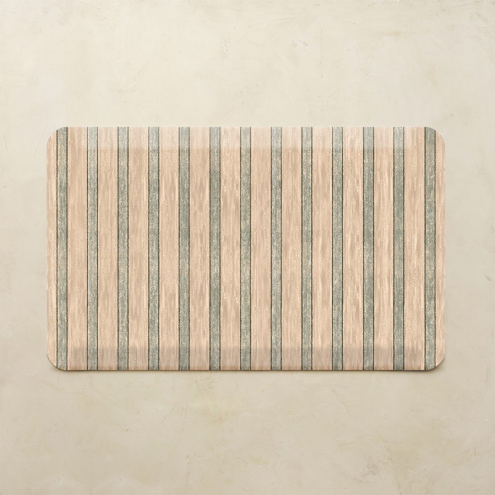 Rectangular kitchen mat with striped pattern on a beige background